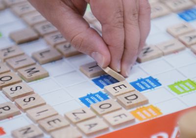 9/8/2012 Shillington, PAA player places a scrabble tile on the board.At the Immanuel UCC in Shillington Saturday afternoon during a Scrabble tournament to raise money for the Literacy Council. There were four teams participating.&amp;